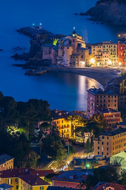 View of the village of Camogli and the shore during the blue hour