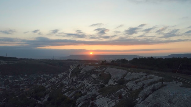 View of the village in the lowland near the cliffs Beautiful sunset