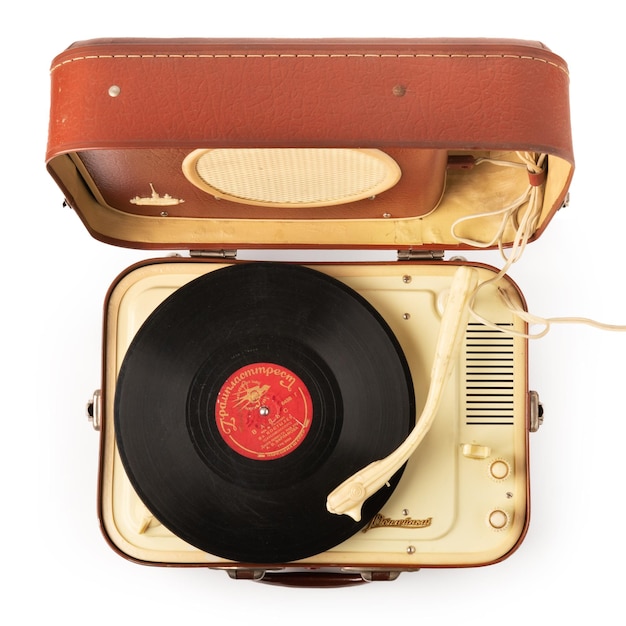 Above view of a vintage portable record player isolated on white