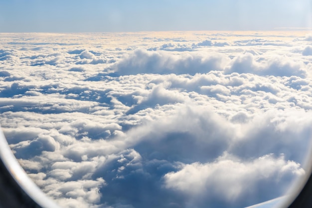 View on white clouds from the airplane window