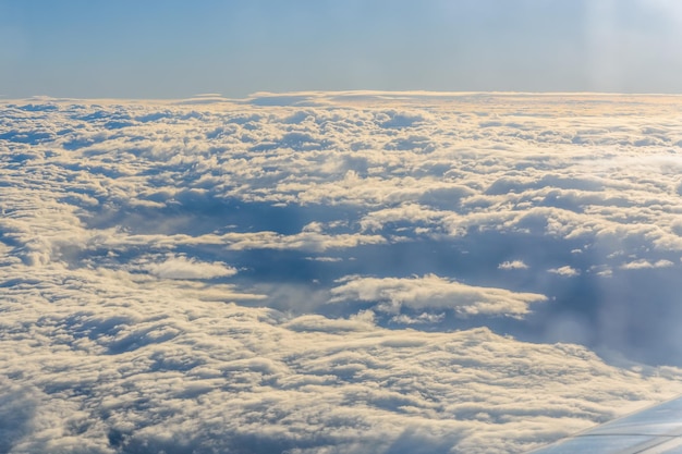 View on white clouds from the airplane window