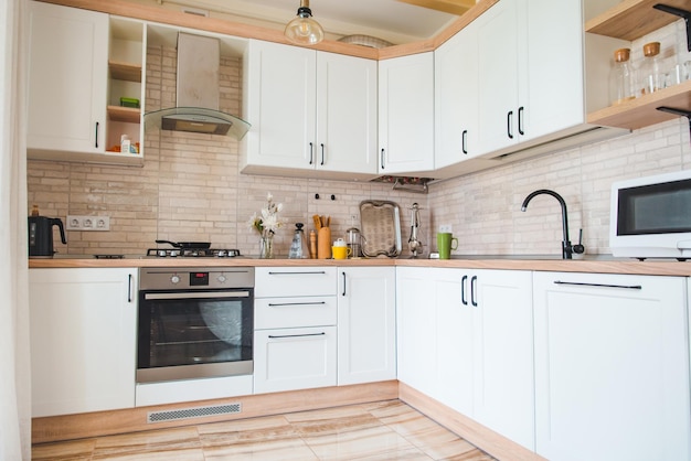 Photo view of white empty kitchen