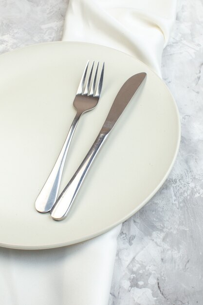 above view white plate with fork and knife on light background kitchen glass ladies femininity food colour meal horizontal