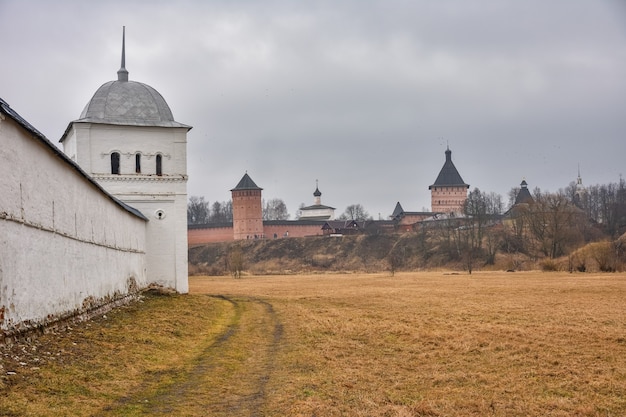 View of the white walls of the Intercession Monastery in Suzdal