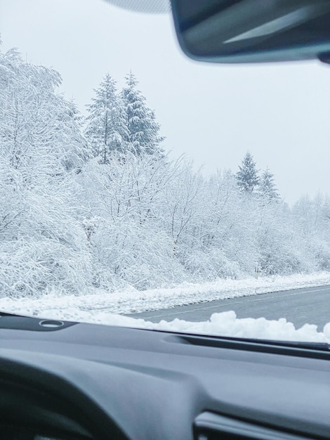 A view of the winter landscape from the window of the car