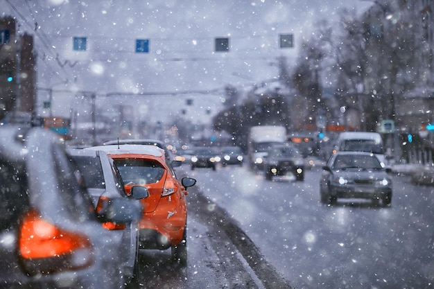 view of the winter road from the car, traffic in the seasonal city, bad weather in the northern city