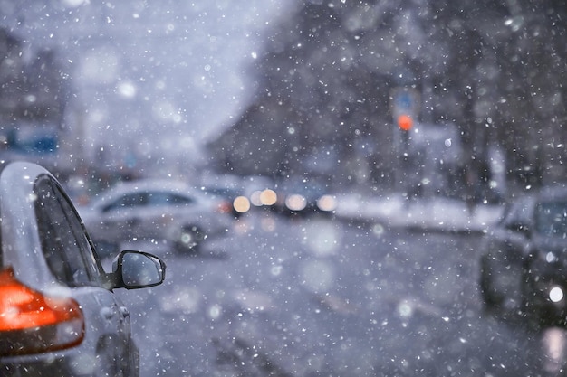 view of the winter road from the car, traffic in the seasonal city, bad weather in the northern city