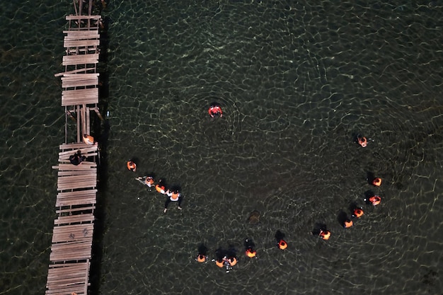 A view of a wooden bridge over a lake