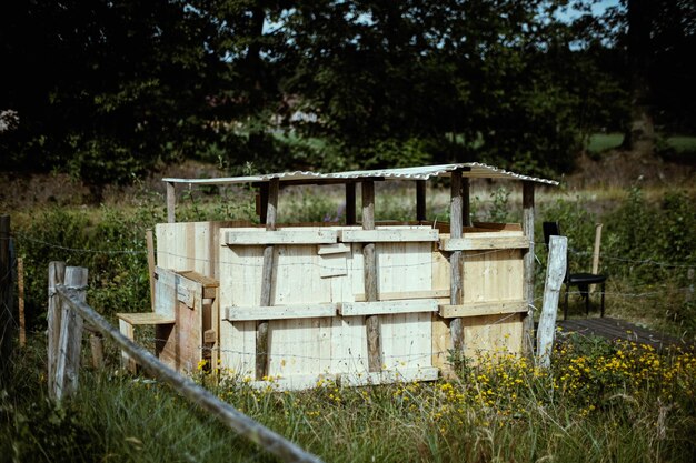 View of wooden structure on field