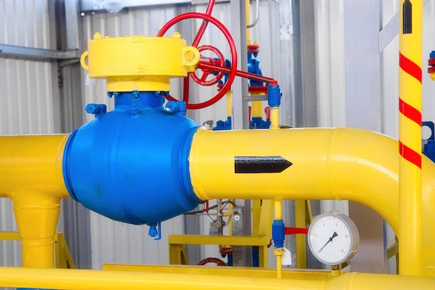 Photo view of yellow pipe for transporting natural gas inside gas distribution station industrial