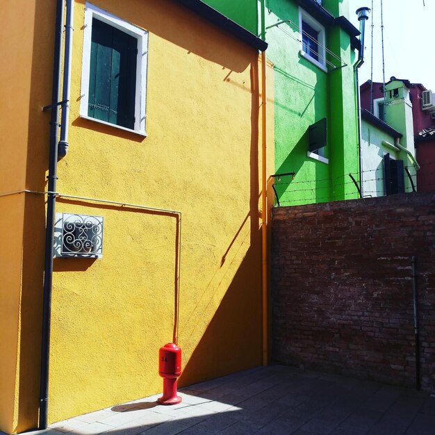 Photo view of yellow wall of building