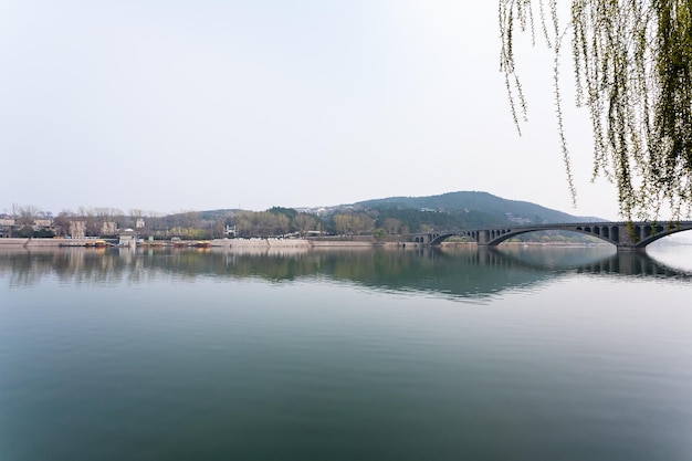 Photo view of yi river and east hill in longmen