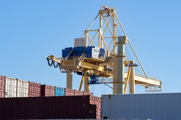 Viewpoint above the cargo seaport on the background of blue sky