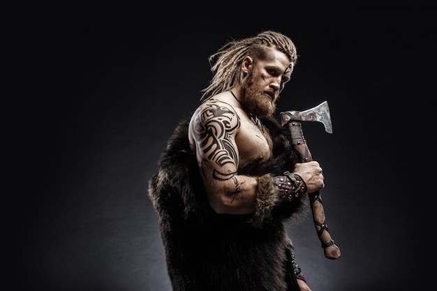 Viking warrior dressed in the skin of a bear with an axe