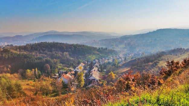 Village against sky during sunset