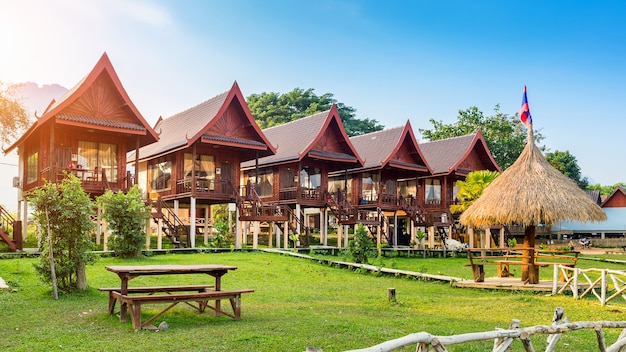 Village and bungalows along Nam Song River in Vang Vieng, Laos.