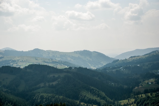 Village in the Carpathian Mountains. In the background, the mountains in the haze