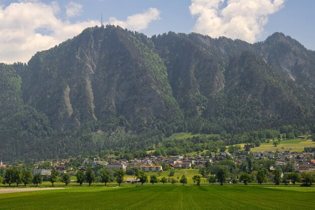 A village in the mountains with a mountain in the background