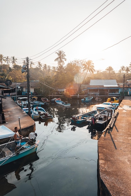 Village and pier in the canal next to the sea in the morning