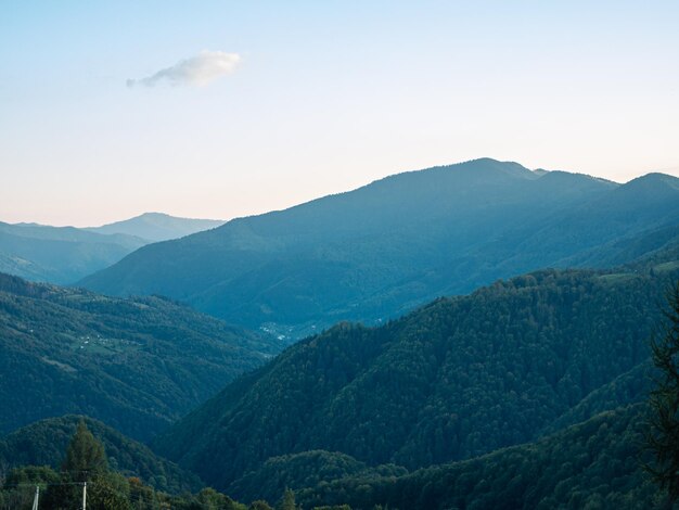 Village in Transcarpathia region scenic Carpathian mountains view Ukraine Europe Autumn countryside landscape fall spruce pine trees Eco Local tourism hiking Recreational activities Vacation