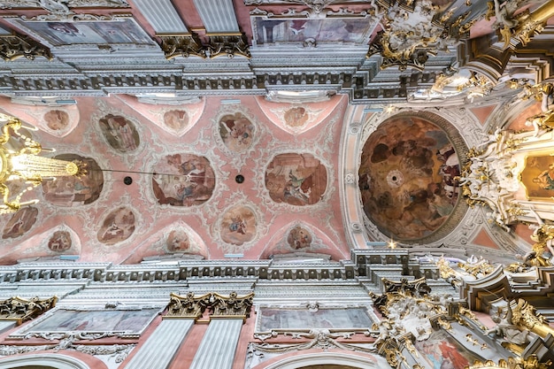 VILNIUS LITHUANIA AUGUST 2019 interior dome and looking up into a old gothic or baroque catholic church ceiling and vaulting