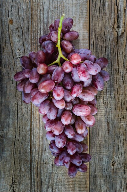 The vine on the old wooden background