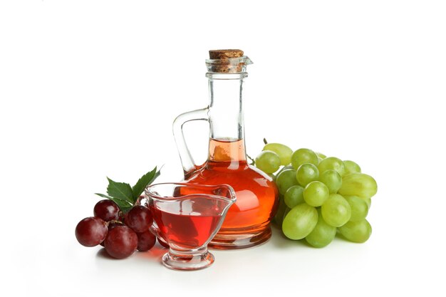 Vinegar and grape isolated on white background