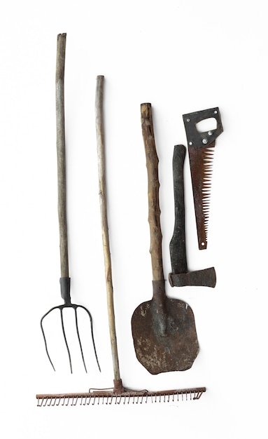 vintage agricultural tools on white background