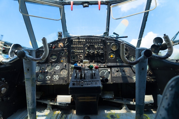 Vintage airplane dashboard, shallow focus on leverers