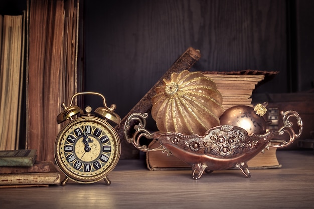 Photo vintage alarm clock showing five to twelve on wood, text space