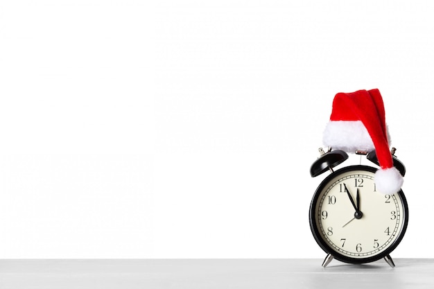 Vintage alarm clock with Santa Claus hat