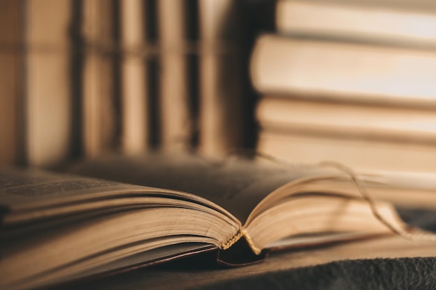 Vintage antiquarian books pile on wooden table