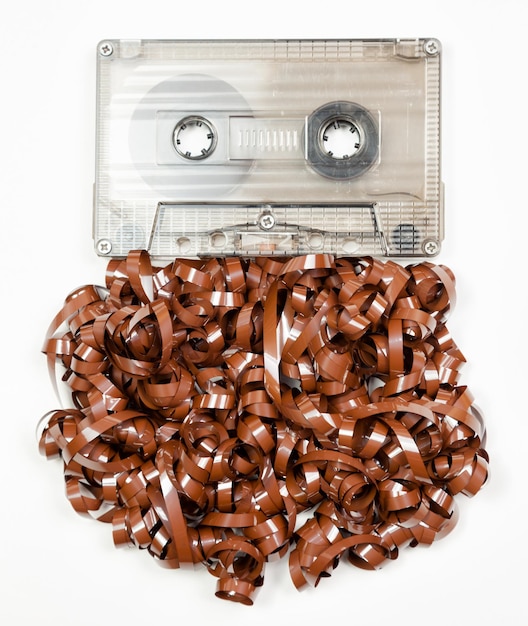 Vintage audio cassette with messed up audio tape