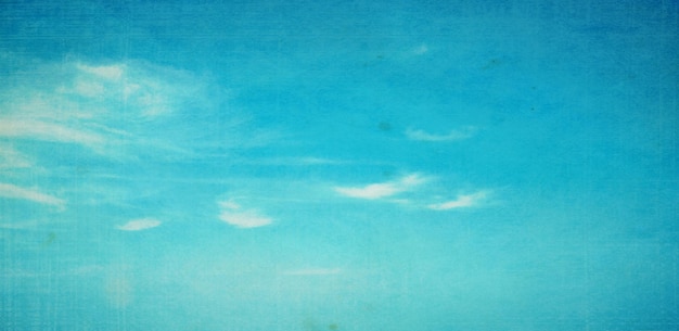 Vintage background in the blue sky with clouds