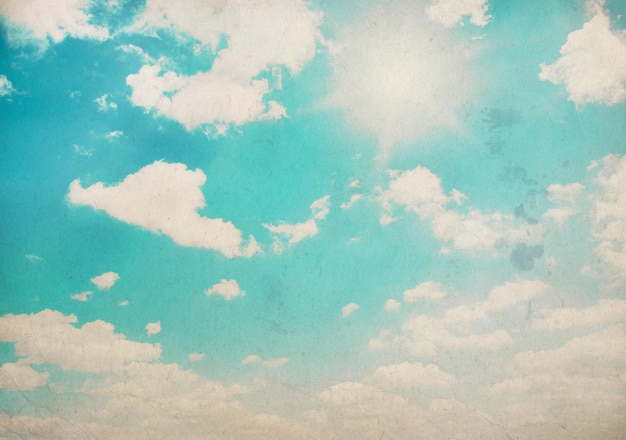 Vintage background in the blue sky with clouds