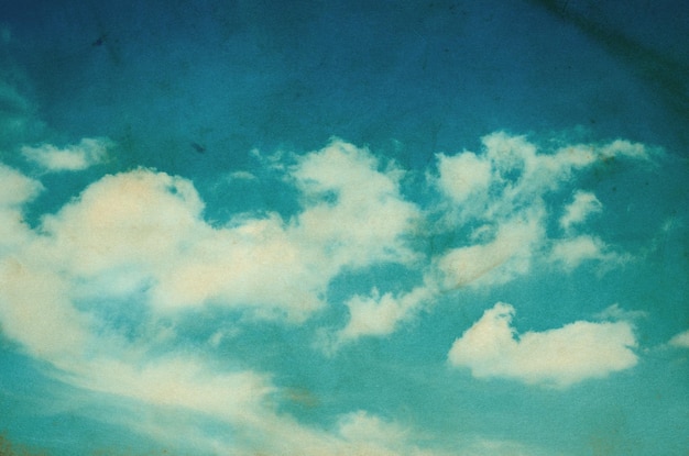 Vintage background in the blue sky with clouds