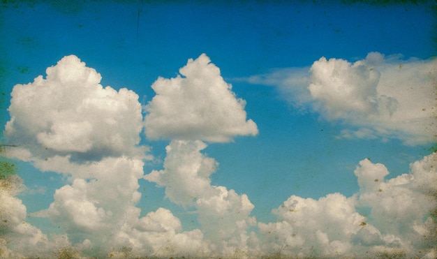 Vintage background in the blue sky with clouds