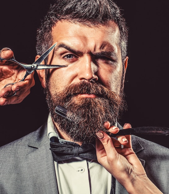 Vintage barber shop, shaving. Portrait bearded man