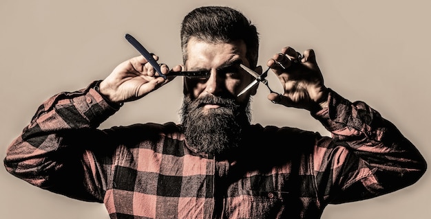 Vintage barbershop, barber shop, shaving. Barber scissors. Mens haircut. Man in barbershop. Bearded man, lush beard, handsome. Hipster, brutal male. Mens haircut. Black and white