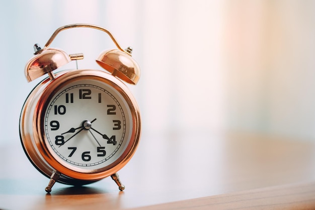 Vintage bell alarm clock on the table