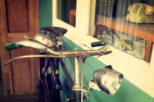 Vintage bicycle in cafe (coffee shop) - retro filter effect styles