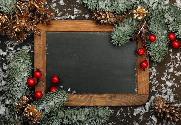 Photo vintage black chalkboard with christmas decoration