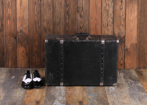 Photo vintage black suitcase and mens accessories