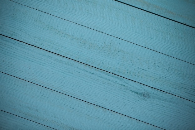 Vintage blauwe houten achtergrondstructuur met knopen en spijkergaten. Oude geschilderde houten muur.