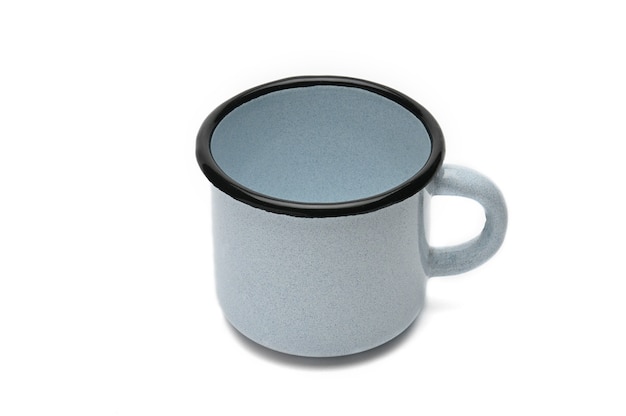 Vintage blue mug made of iron isolatedOld iron cup