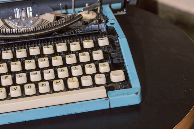 Vintage blue typewriter on a table