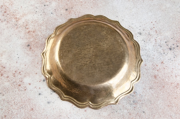 Photo vintage brass plate on concrete.