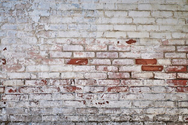 Vintage brick wall, great design for any purposes. Background texture old. Grunge urban backdrop. Cracked surface grunge texture. Red brick wall. Dirty old surface.