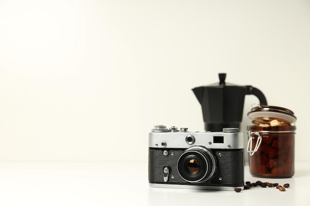 Vintage camera jar of sugar and coffee maker on white background space for text