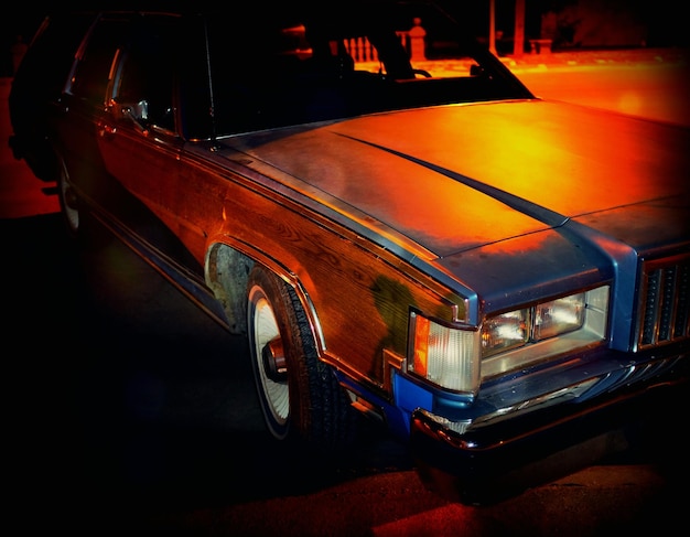 Vintage car on street at night